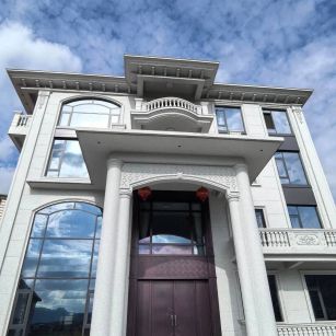 日照白麻别墅外墙干挂石材效果示例